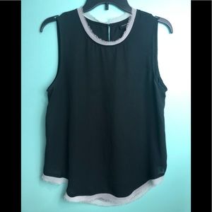 Black sleeveless top with gray/white raw edge trim